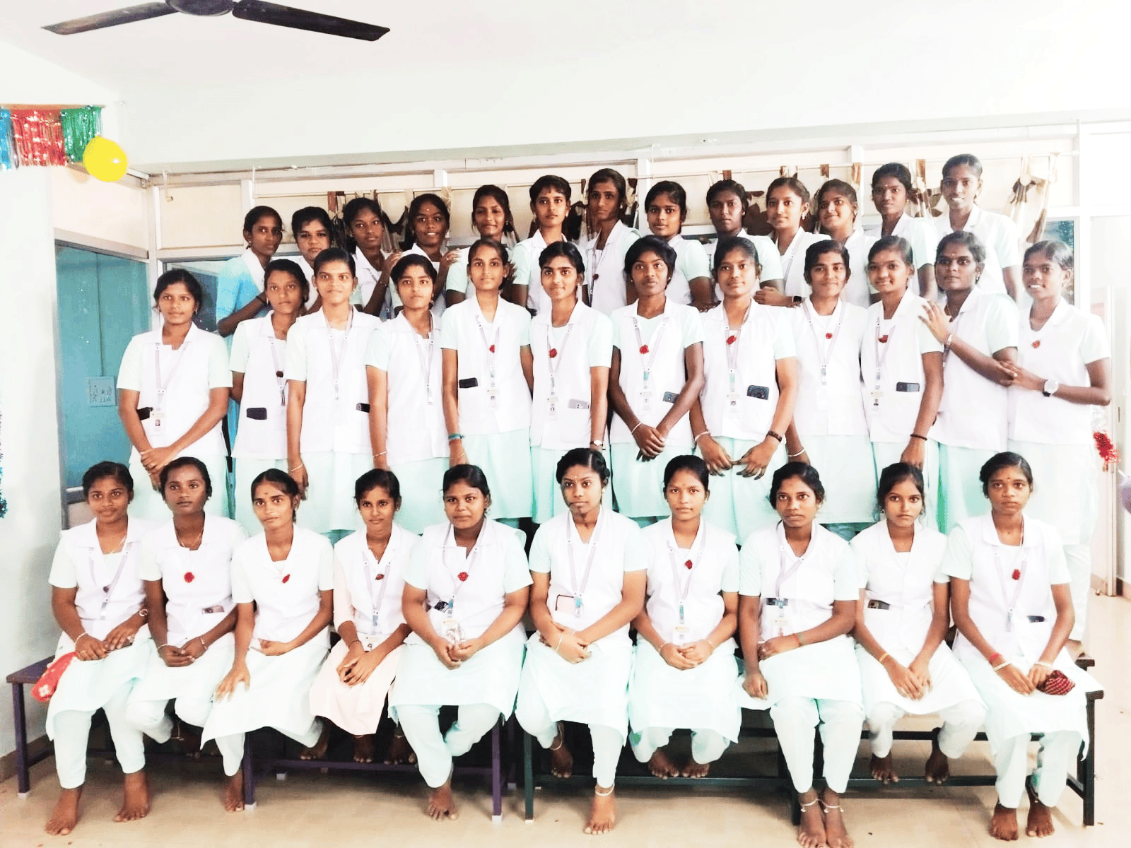 Vinayaga nursing college students in white and mint green uniforms – batch photograph with decorations